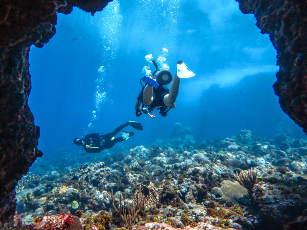 View of the divers under the water cave