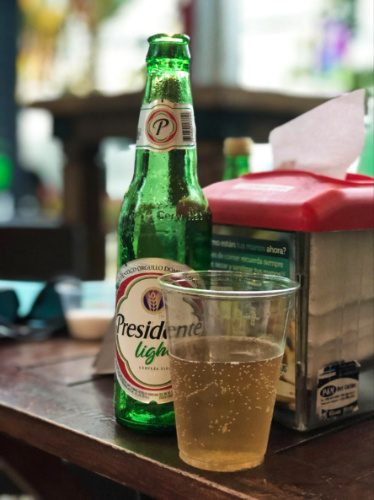 A bottle of Presidente Light beer