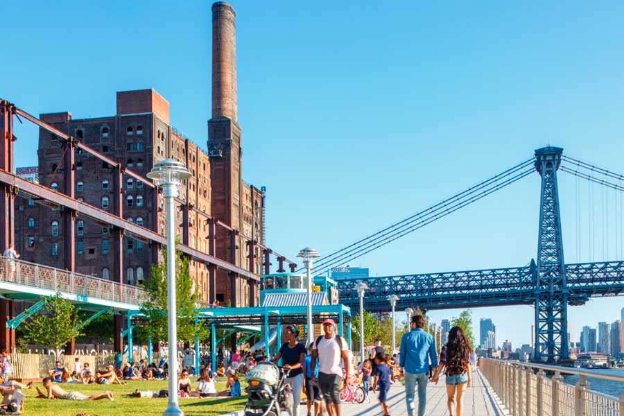 View of people in Domino Park during a sunny morning
