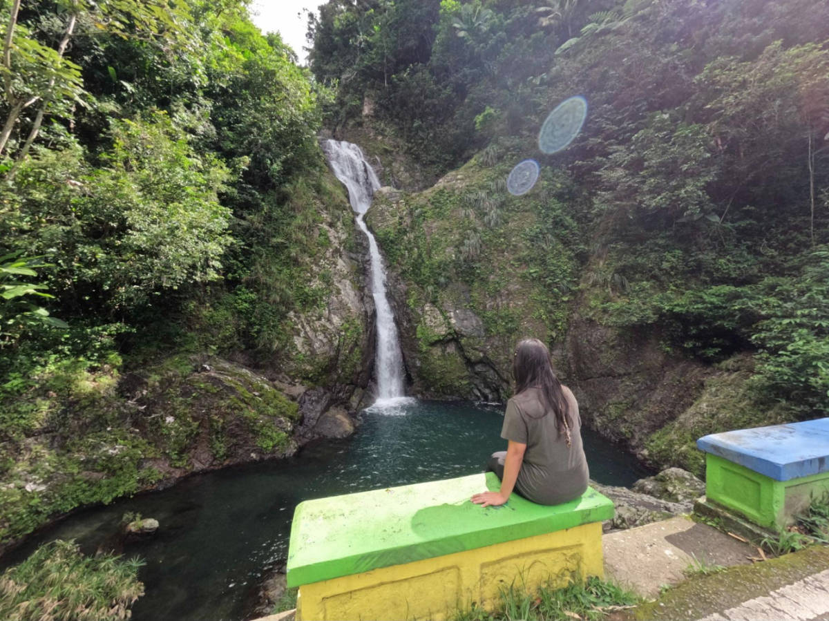 The author Vanessa Ramos admiring Doña Juana Waterfall