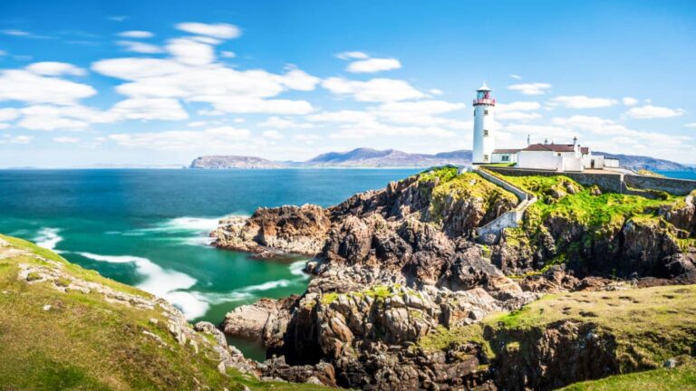 Panoramic view of the island and the lighthouse in Donegal on a sunny day
