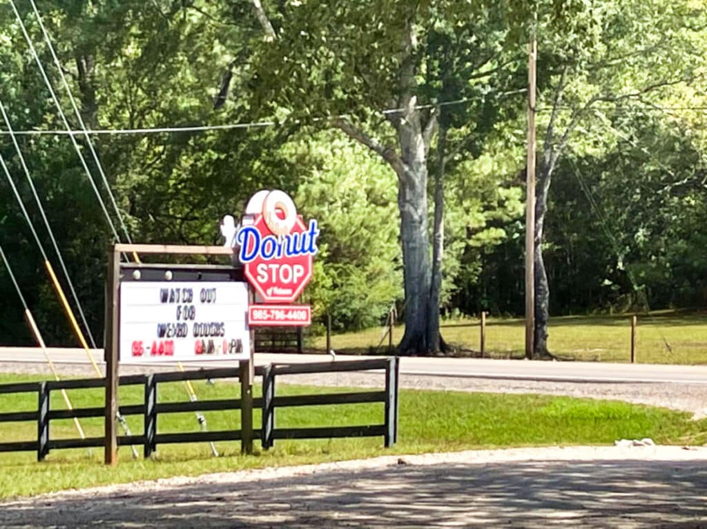 A signage of "Donut Stop" near the road in Folsom