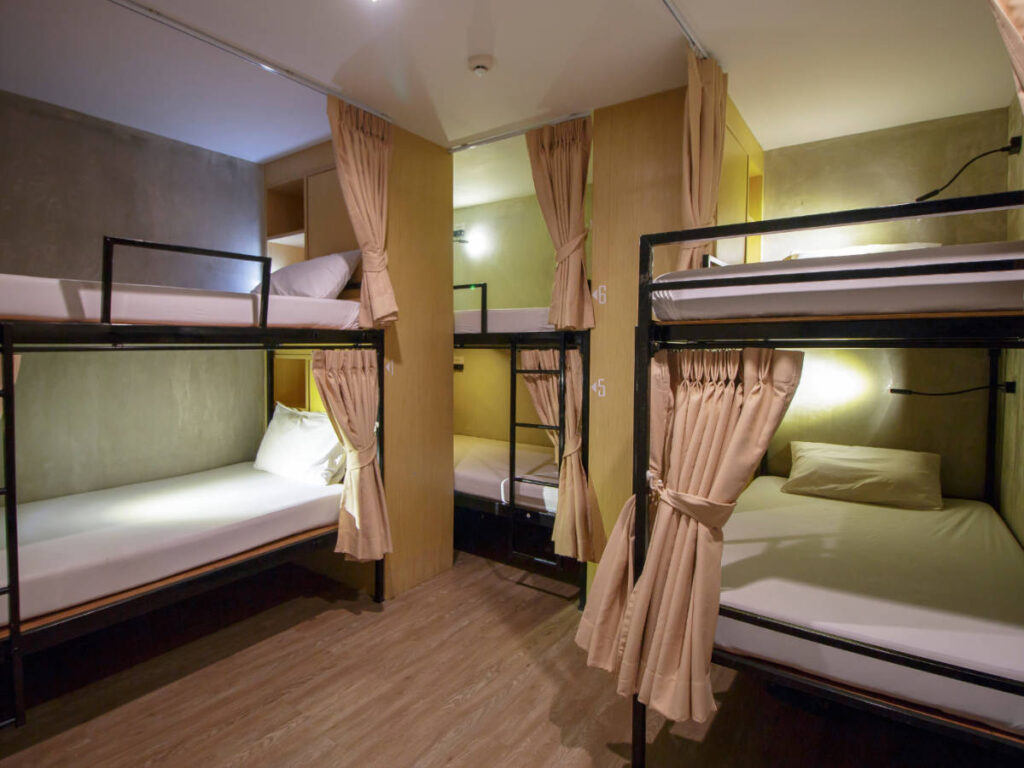 Bunk beds with curtains on a room