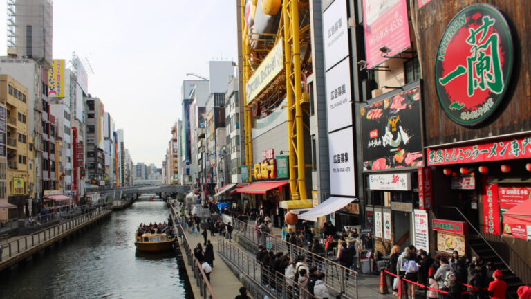 Group of people along the Dotonbori River in Osaka