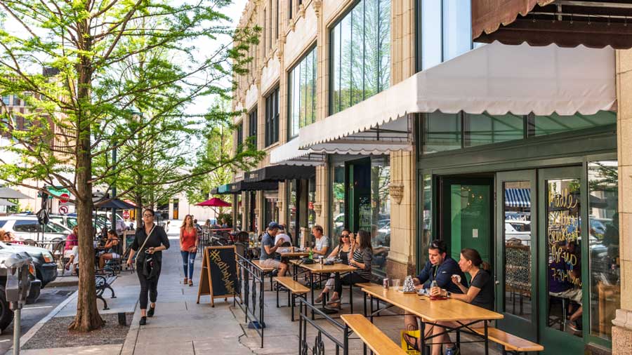 People on an outdoor dining in downtown Asheville