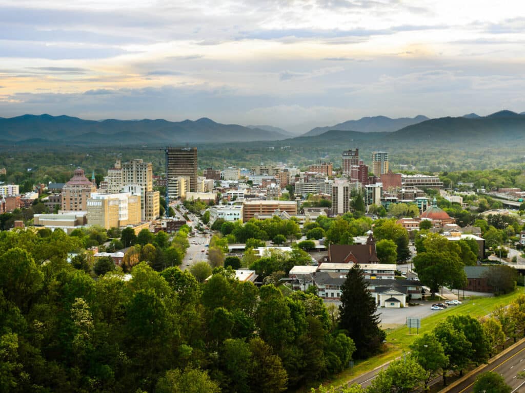 Aerial view of Downtown Asheville surrounded by mountains in North Carolina