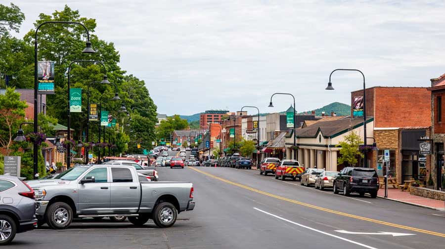 Cars parked on the side of the road in a street in Downtown Boone