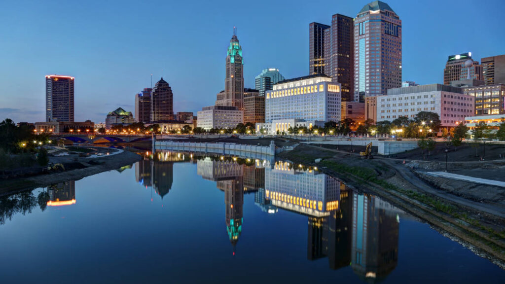 Reflection of the buildings at Downtown Columbus on a body of water at night