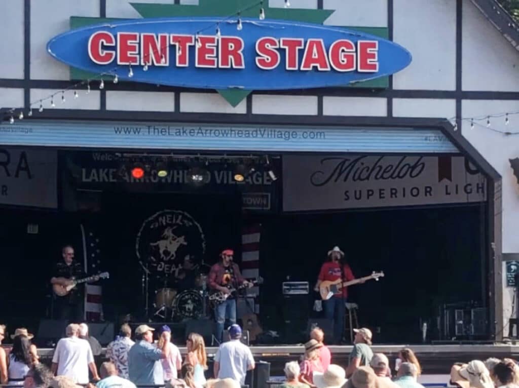 A band performing on a stage in Lake Arrowhead