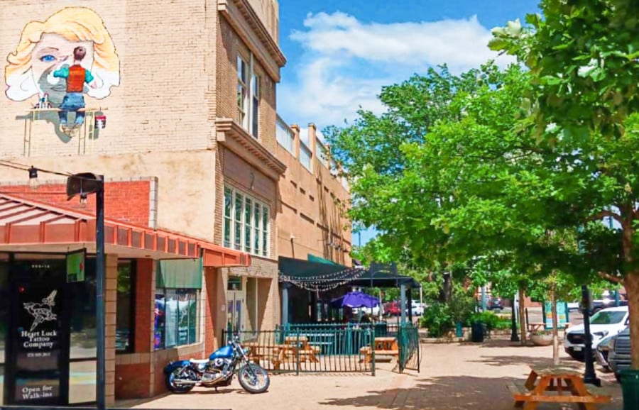 View of the shops and empty sidewalk in Downtown Greeley