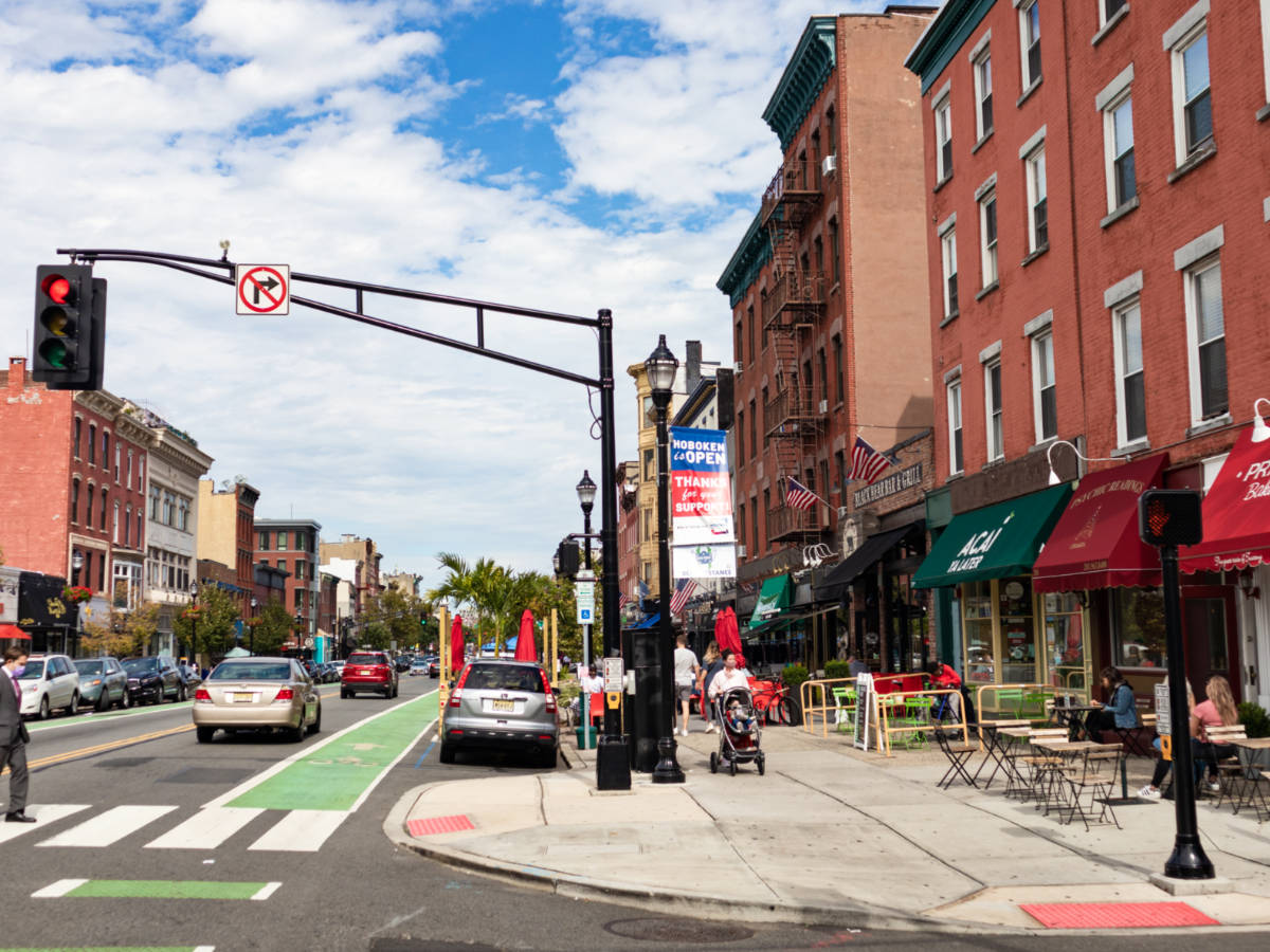 View of the brick walled buildings and the busy street of Downtown Hoboken