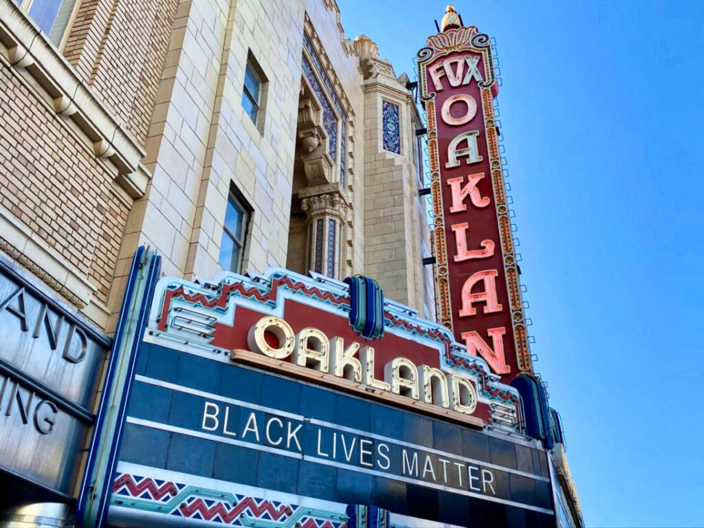 A Black Lives Matter sign age outside the building in downtown Oakland