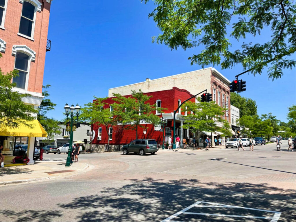 A vibrant red building along Downtown Petoskey with a clear blue sky in the background