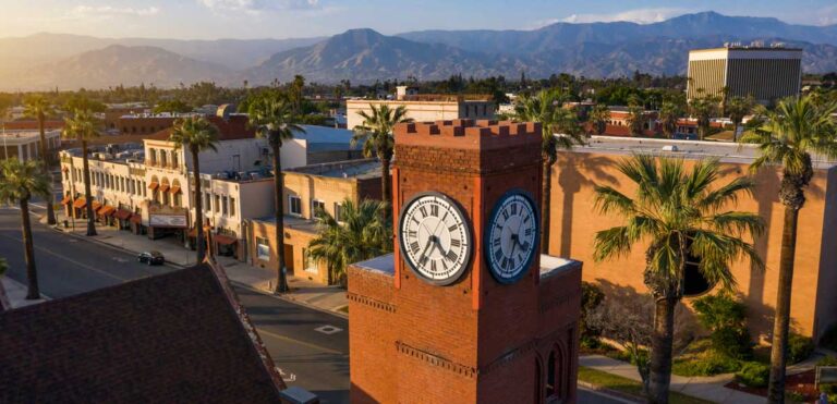 A clock tower in Downtown Redlands at sunset