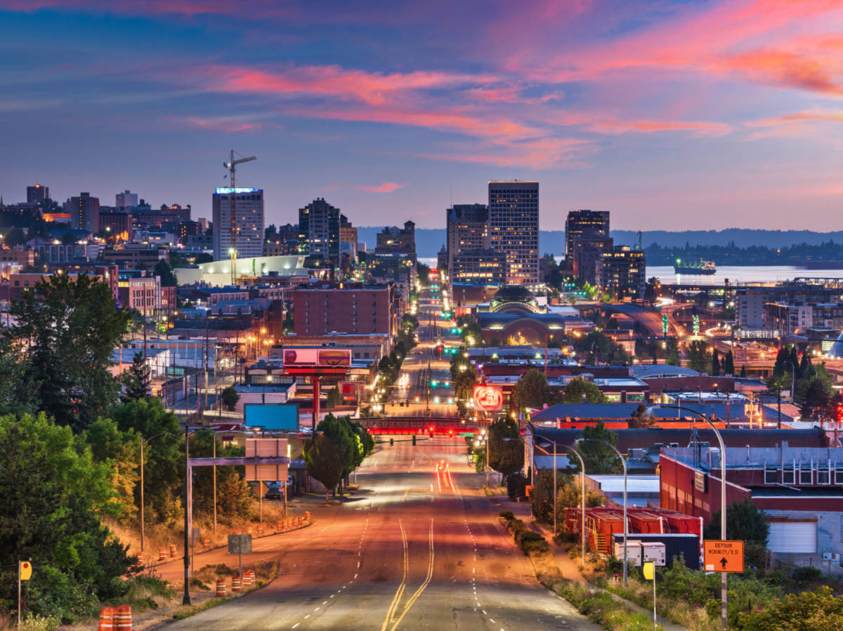 Scenic view of the illuminated Downtown Tacoma, seen from the empty road at twilight