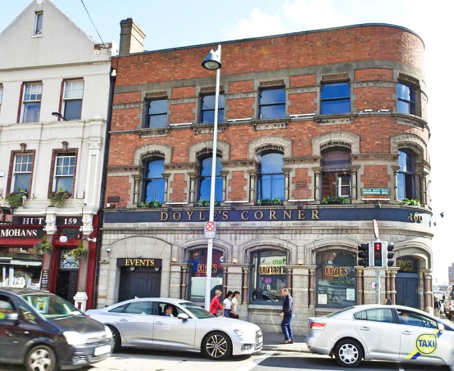 Exterior view of the popular local pub Doyle’s Corner with parked cars in the street of Phibsborough