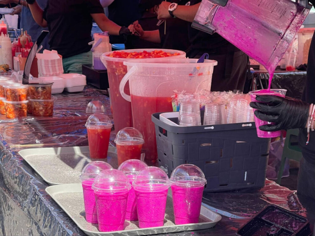 Dragon fruit smoothie being served on the customers