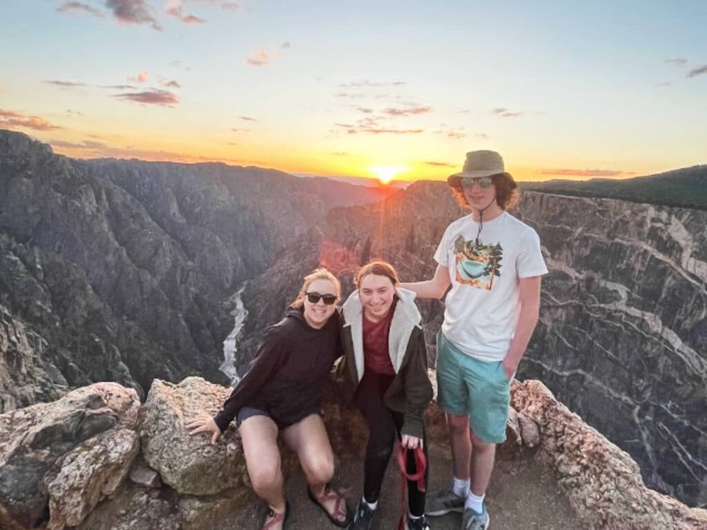 The author, Laura Falin with her kids at the Dragon Point during sunset