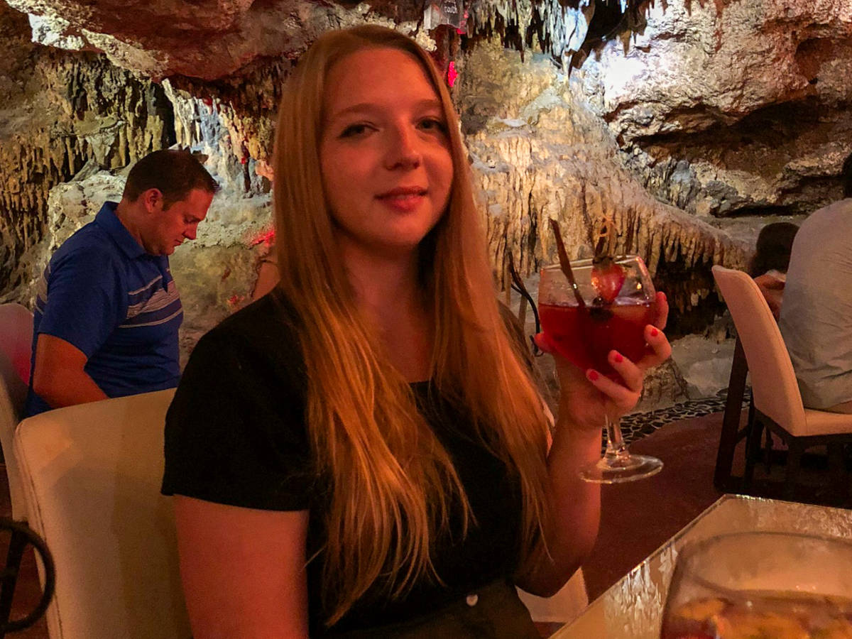 Author Taylor holding her drink at Alux