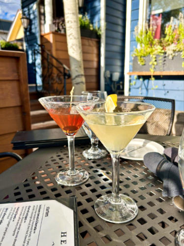 Two different glasses of drinks on the table at Hearthstone Restaurant