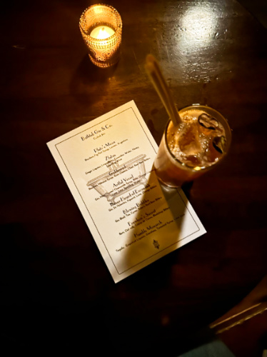 A drink and the menu on the table of Bathtub Gin & Co