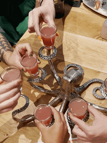 Clinking the glasses of drinks at Lady Nomada