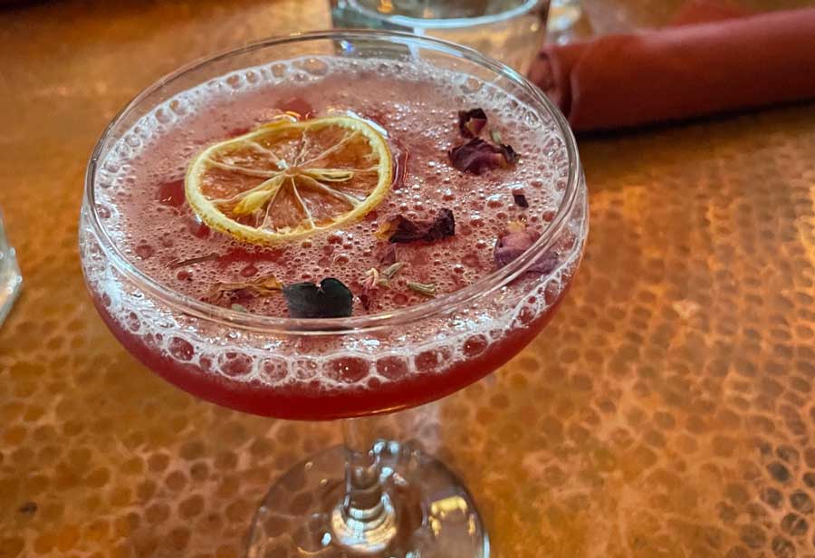 A drink with lemon served in Strada