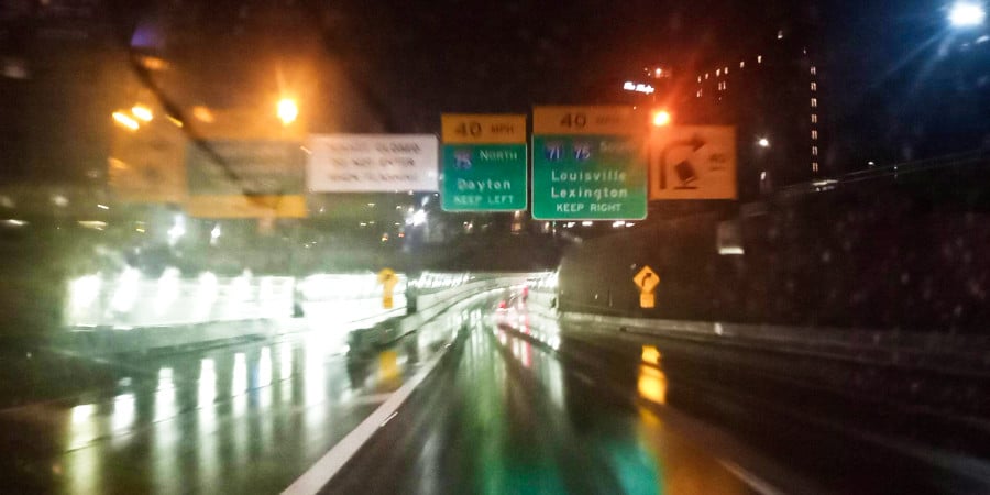 View of the cars driving on the wet road after the rain