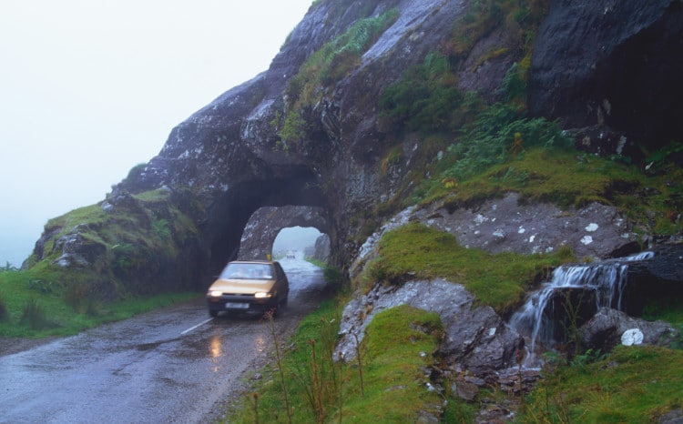 A car navigating narrow roads through a tunnel