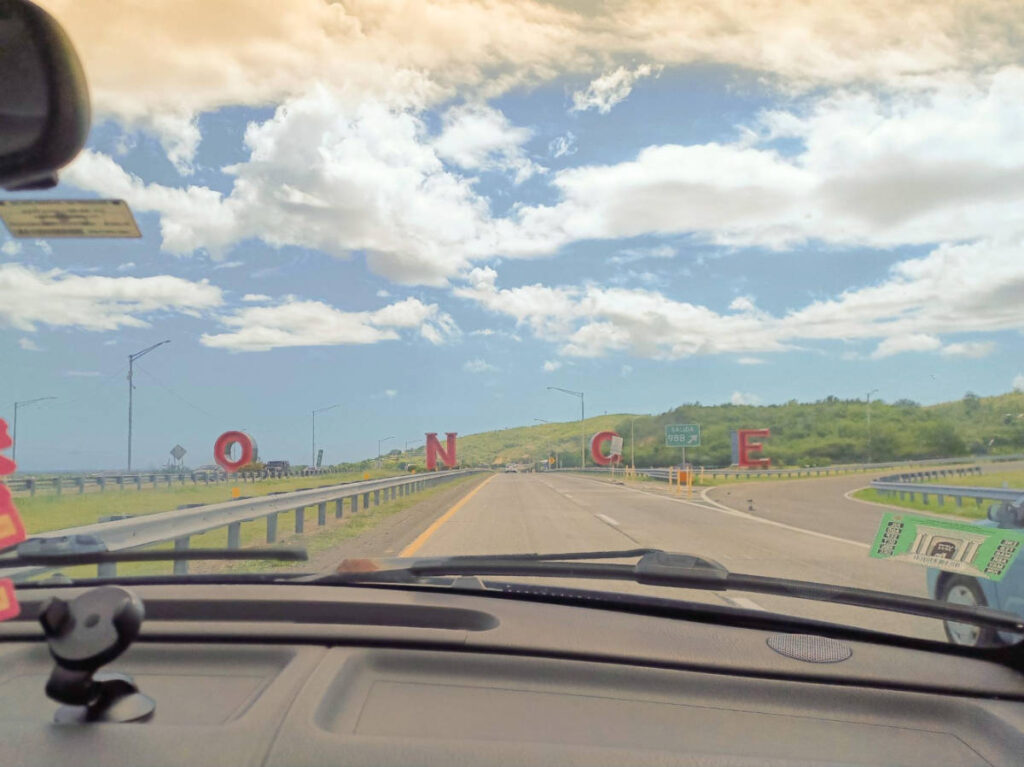 View of the signage of PONCE from the drive on the highway