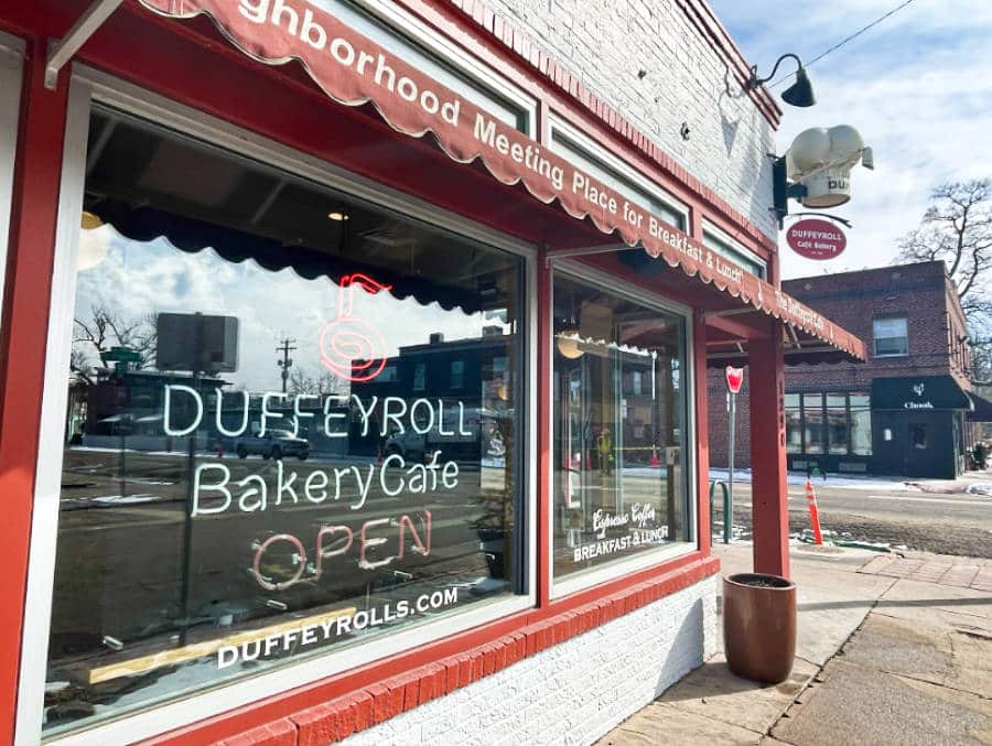 View of the red exterior of Duffeyroll Cafe located on the corner street