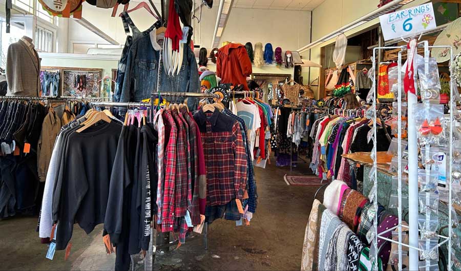 Clothes, accessories, and more displayed inside the Dumpster Values