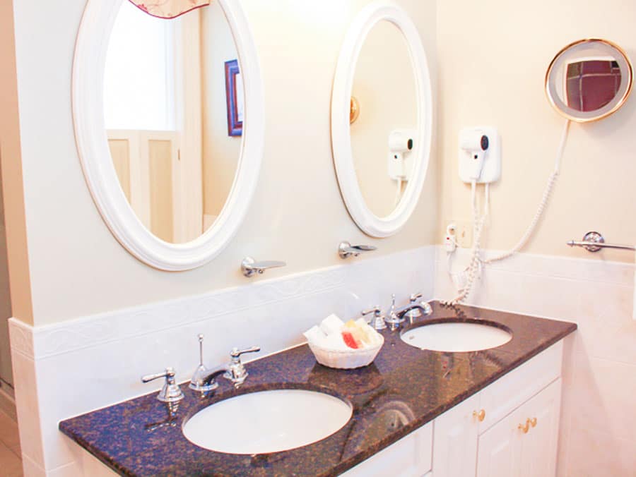 View of the sink and mirrors inside the bathroom in Dundee Arms Inn