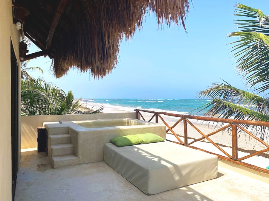 An outdoor jacuzzi in the balcony of a room in Dune Boutique Hotel
