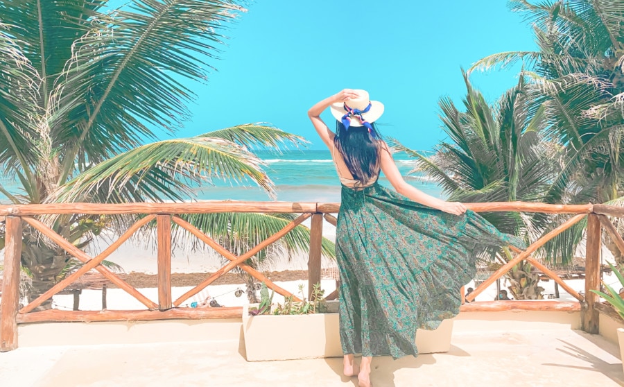 Woman on balcony at the Dune Boutique Tulum