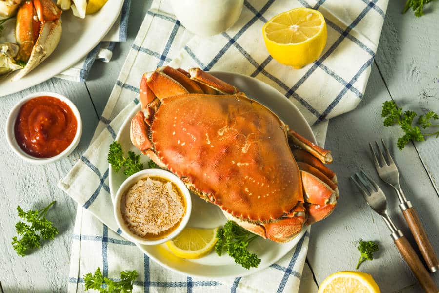 A plate of Dungeness Crab with butter and lemon