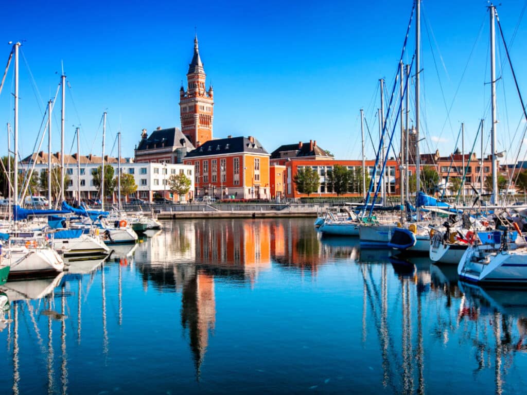 Boats under the clear blue sky on a port in Dunkirk