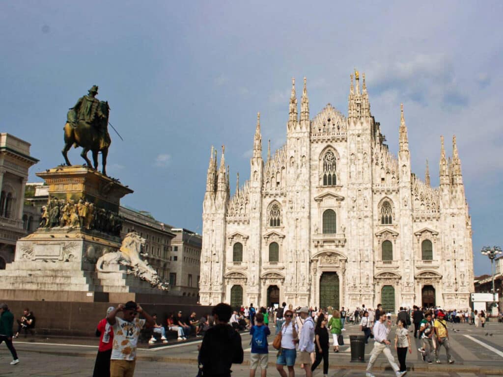 View of the crowd wandering at the Duomo Square with the The Duomo Cathedral in the background