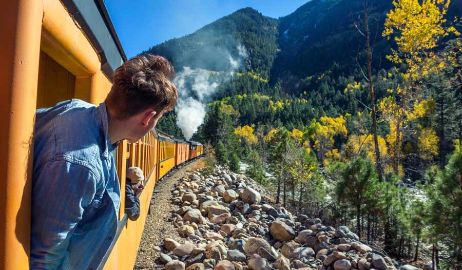 A man looking out on the window train of Durango-Silverton Train