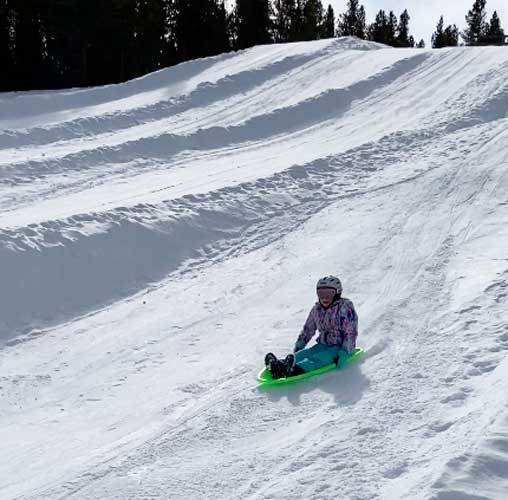 The author's daughter on a sled in Dutch Henry Hill
