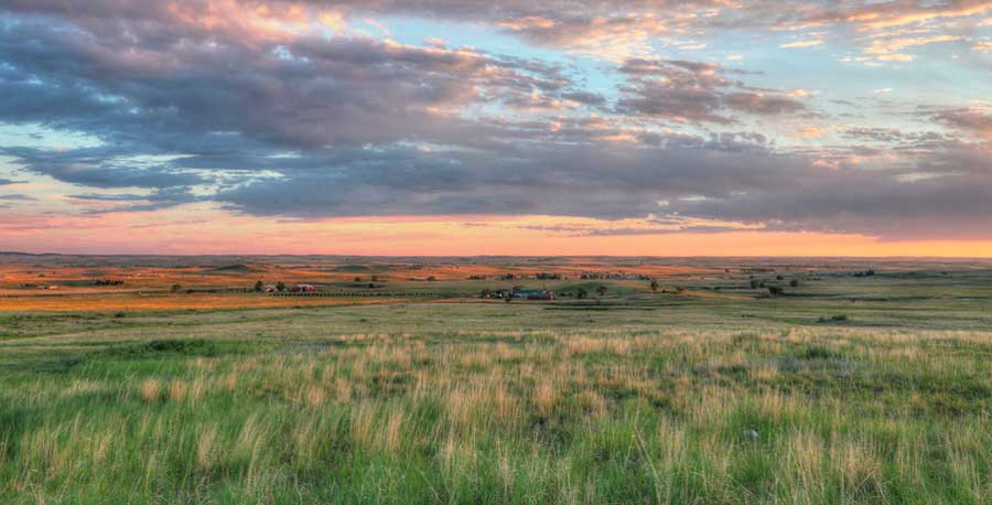 Scenic view from the Eastern Plains of Colorado and the colorful sky over it during sunrise
