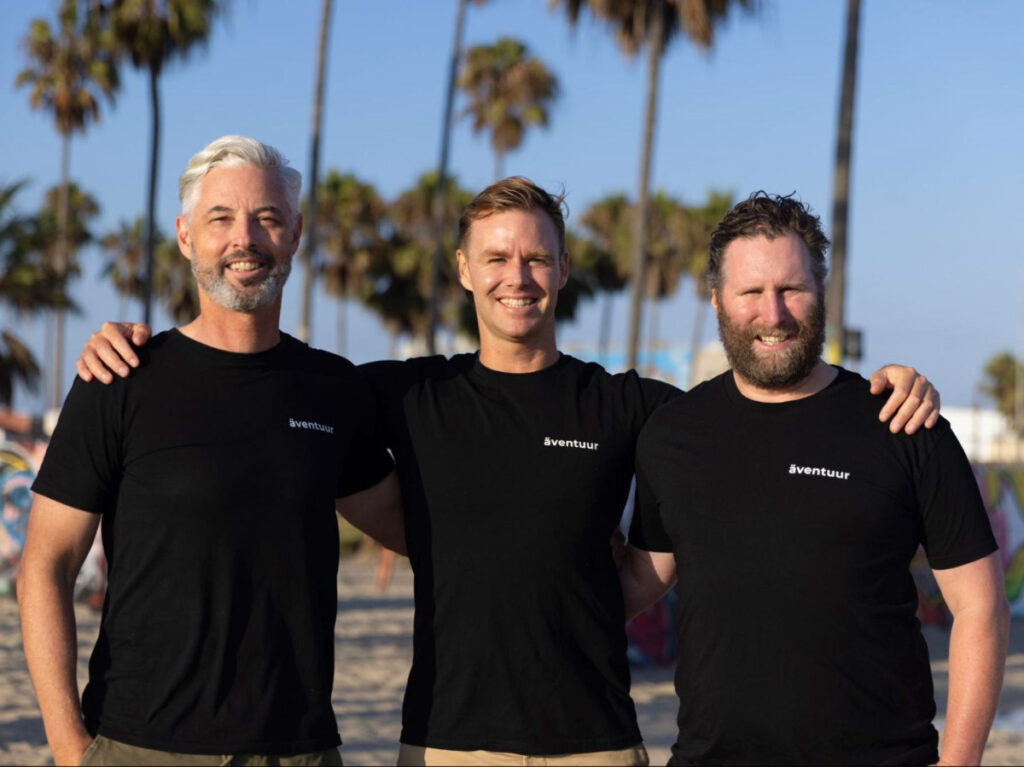 Edelman alongside Aventuur chairman Andrew Ross and co-founder Richard Duff posing for a photo