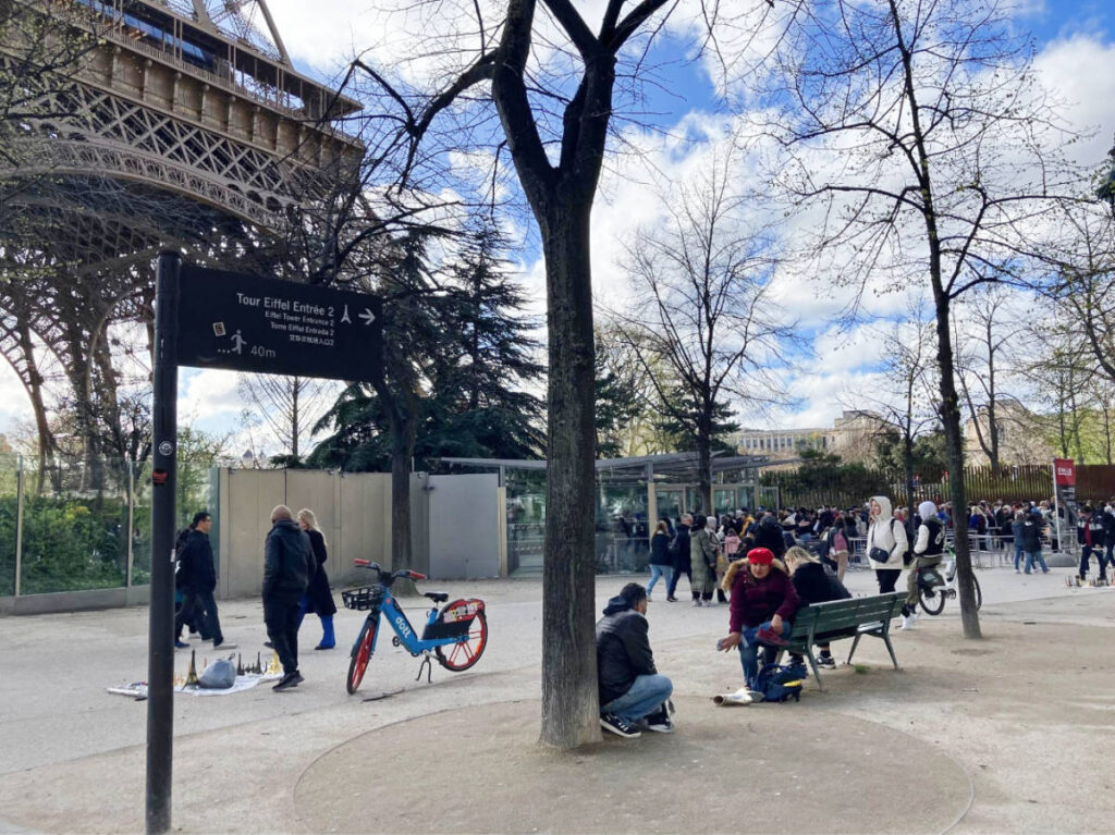 A signage for the entrance to Eiffel Tower