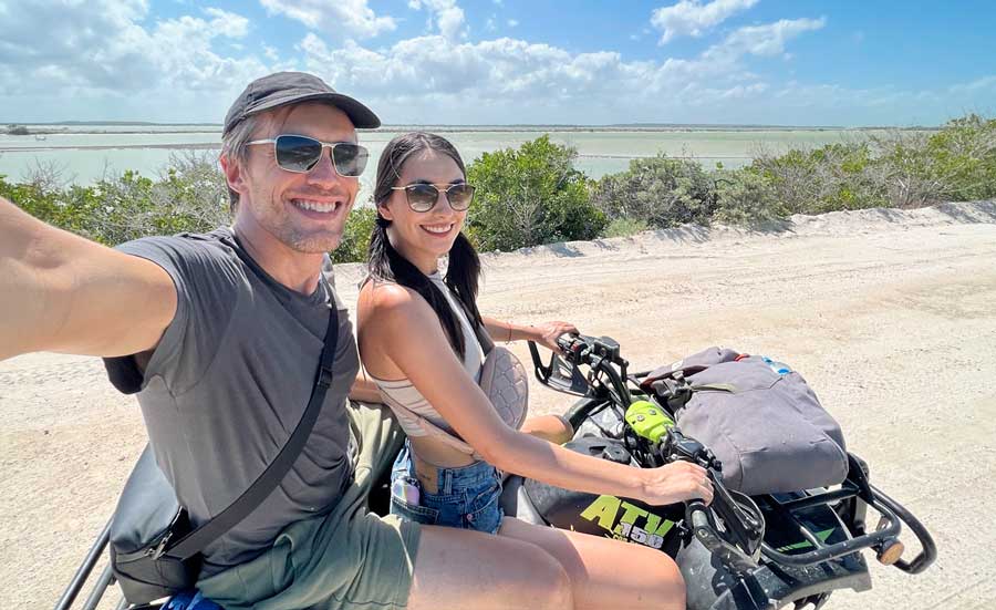 The author with her partner Clara riding an ATVs from El Cuyo