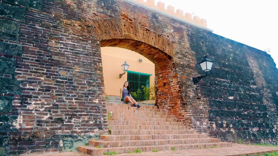 The author sitting on a staircase in El Fortin Mirasol