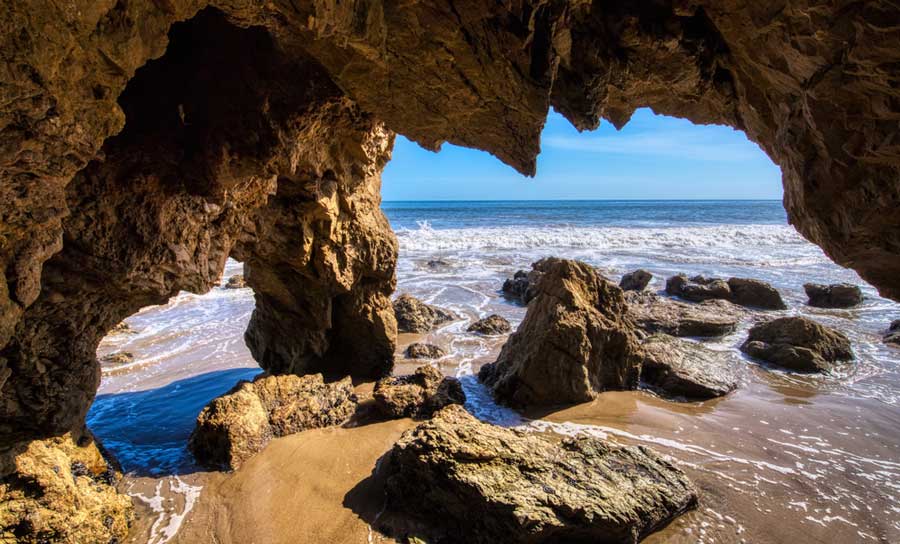 View from the inside of a rock shelter in El Matador Beach