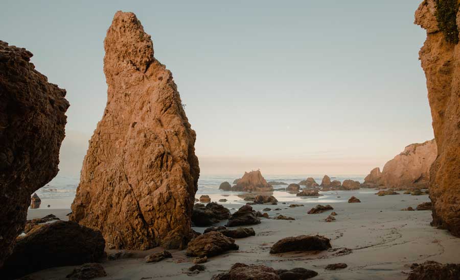 Rocks on the shoreline of El Matador Beach at morning