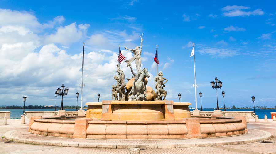 View of the Raices Fountain under the clear blue sky in Puerto Rico