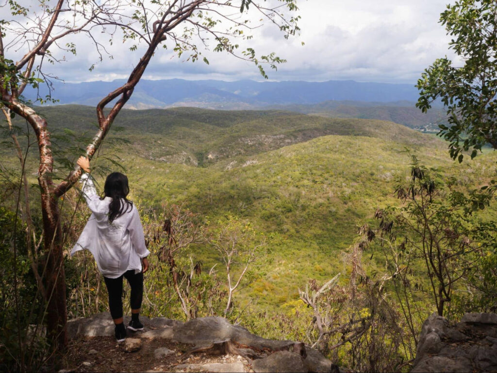 The author, Vanessa Ramos admiring the view during her hike at El Vigia trail in Guanica