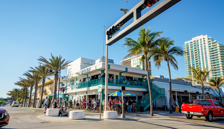 View of a beach bar Elbo Room in a busy corner of Las Olas Blvd and Ocean Drive
